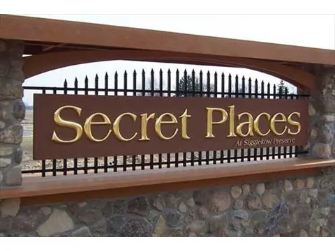 Brass letter sign marquee at secret places subdivision
