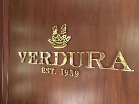 Polished brass letters and logo on interior door